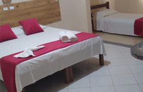 Quarto Triplo do Infinity Pousada