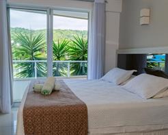 Suíte com cama King-size e Varanda