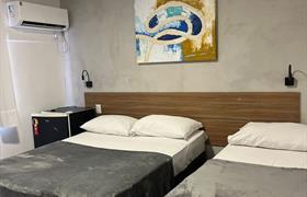 Quarto Econômico triplo casal do Pousada Itacuruçá Inn...