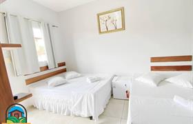 Quarto triplo + cama auxilar do Pousada Itaguaçu