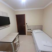 Quarto individual banheiro compartilhado