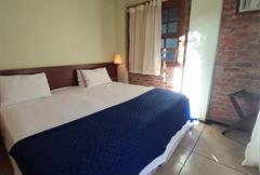 Quarto Standard com Cama de Casal ou 2 de Solteiro e Vista do Jardim