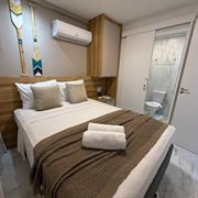 Standard - 1 Casal + Sofá Cama na Sala