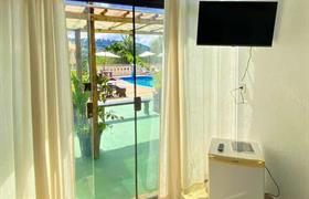 Quarto Duplo com Vista da Piscina do Pousada Encantos da Serra Macacos
