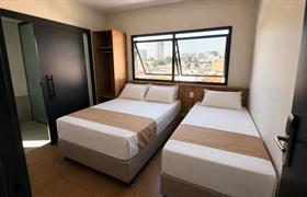 Quarto Triplo Deluxe Casal do Uny Hotéis Centro