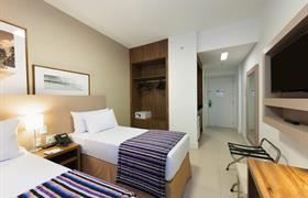 Cama doble ejecutiva de Matiz Multi Suítes Duque de Caxias Hotel