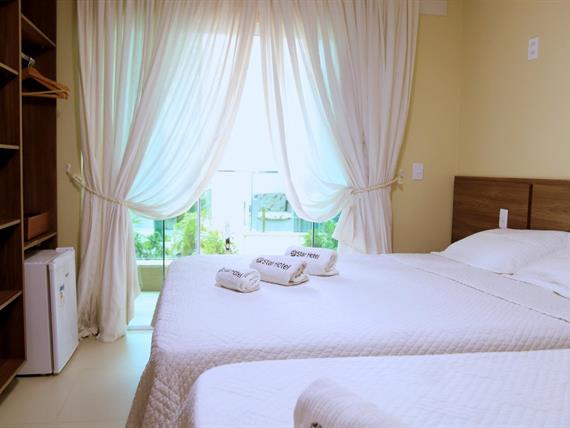 suíte tripla deluxe - varanda.jpeg