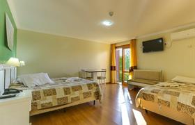 Quarto Quadruplo Luxo do Zermatt Hotel
